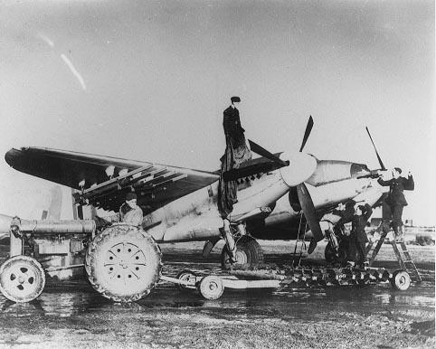 Photograph of a Mosquito being armed at RAF Banff